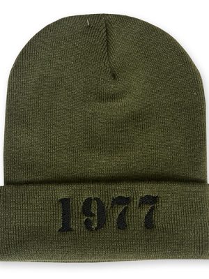 Olive green cuffed beanie hat with black embroidered "1977" text on the front.
