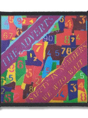 A punk sew-on patch featuring The Adverts "Safety in Numbers" album artwork in a bold, colorful design.