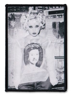 Black-and-white Debbie Juvenile punk sew-on patch showing a heavily made-up punk figure wearing a graphic T-shirt.