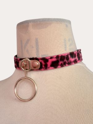 Hot pink and black leopard print adjustable punk collar on a mannequin, with silver-tone front O-ring detail and buckle fastening.