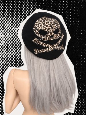 Black leopard print skull beret handmade by Poison Clothing UK, featuring a skull and crossbones design with silver safety pins.