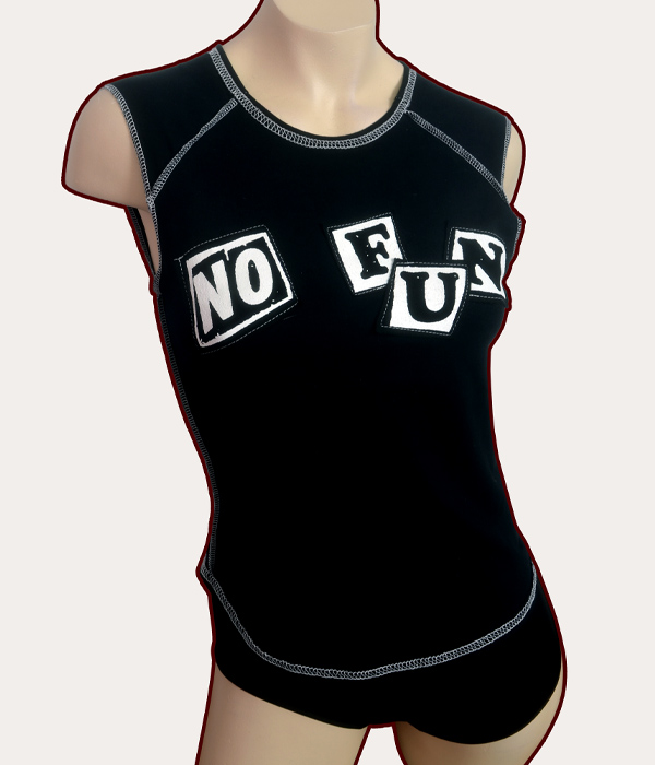 Black woman’s sleeveless babydoll tank top with grey overlocked stitching and white No Fun stencilled appliqué lettering across the front.