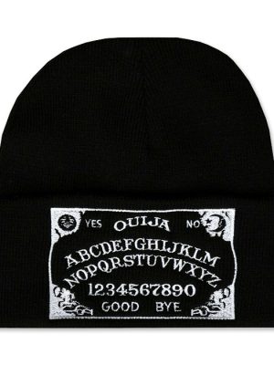 Black knitted gothic beanie hat with wide folded cuff featuring a rectangular black and white Ouija board patch with alphabet letters, numbers, sun and moon symbols.