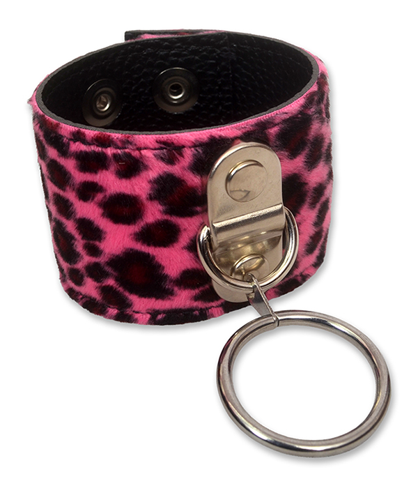Pink leopard print O ring wrist cuff made from faux fur and black PU leather, shown fastened with adjustable press studs and a large silver metal ring.