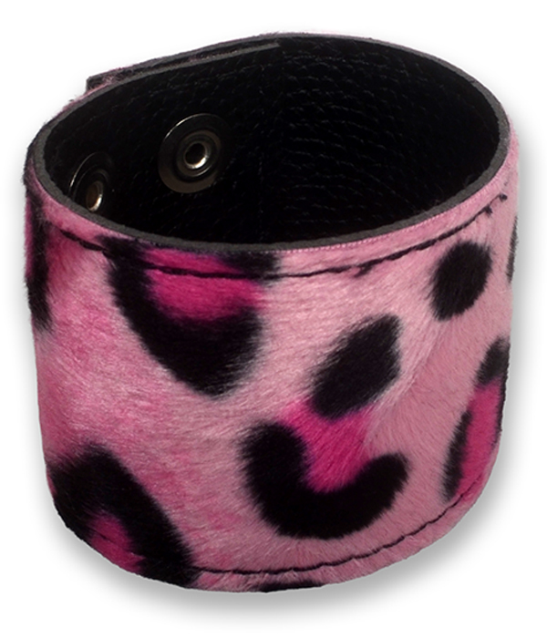 Light pink leopard print wrist cuff made from faux fur and black PU leather, shown fastened with adjustable press studs.