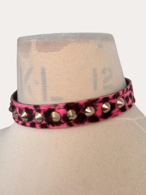Pink and black leopard print adjustable punk collar with silver-tone cone studs, shown on a mannequin.