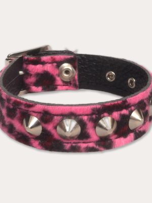 Hot pink and black leopard print punk wrist cuff with a soft furry finish, chunky silver-tone cone studs and black inner lining.