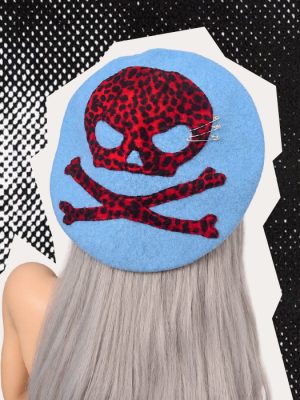 Powder blue gothic punk beret with burgundy red and black leopard-print skull and crossbones appliqué