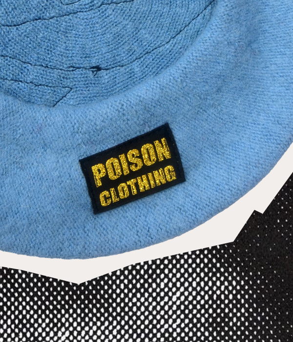 Gold Poison Clothing branded woven label sewn inside a handmade powder blue beret