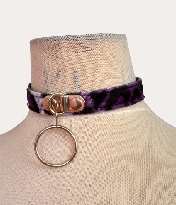 Purple and black leopard print adjustable punk collar on a mannequin, with silver-tone front O-ring detail and buckle fastening.