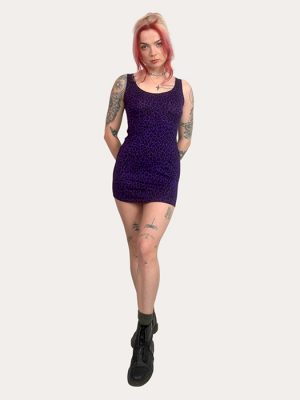 Model wearing a fitted sleeveless purple leopard print mini dress from Poison Clothing, made in the UK.
