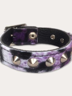 Purple, lilac, white and black leopard print punk wrist cuff with a soft furry finish, silver-tone cone studs and black inner lining.