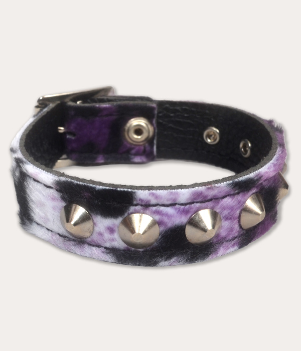 Purple, lilac, white and black leopard print punk wrist cuff with a soft furry finish, silver-tone cone studs and black inner lining.