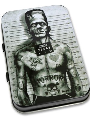 Black and grey metal tin featuring Frankenstein’s Monster mugshot artwork with tattoos and height chart background.