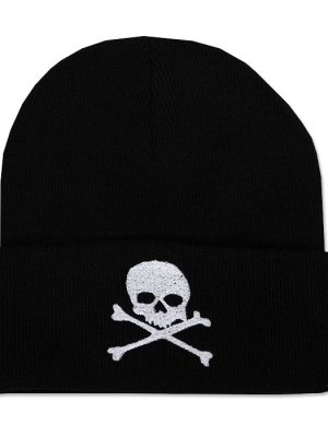 Black knitted punk beanie hat with wide folded cuff featuring a white embroidered skull with hollow eye sockets above two crossed bones.