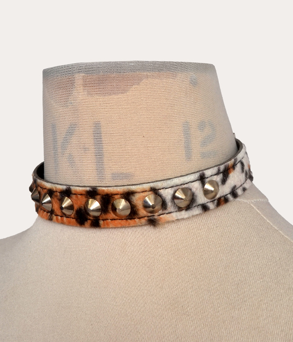 Leopard print adjustable punk collar with silver-tone cone studs, shown on a mannequin and laid flat with buckle fastening.
