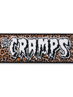 The Cramps sew-on patch with white logo over leopard print background.