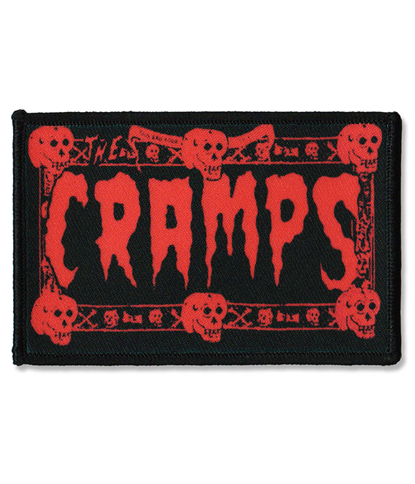 Rectangular black sew on patch featuring red The Cramps logo with skull border design in psychobilly punk style.