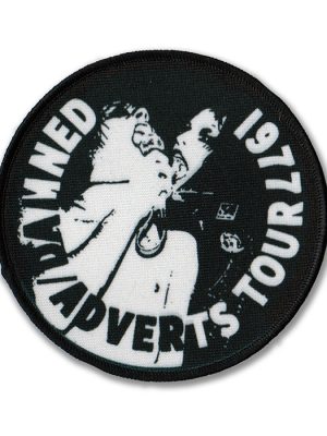 Round black and white sew-on patch with live imagery and text reading “Damned Adverts Tour 1977.”