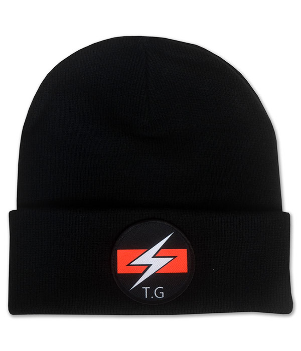 Black cuffed beanie hat featuring circular Throbbing Gristle TG lightning logo patch in red, white and black.