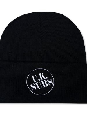 Black knitted punk beanie hat with wide folded cuff featuring the UK Subs band logo embroidered in distressed white lettering inside a thin white circular outline.