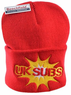 Bright red Beechfield knitted beanie hat with wide turn-up cuff featuring an embroidered UK Subs logo in red and yellow over a bold yellow starburst with a white centre.
