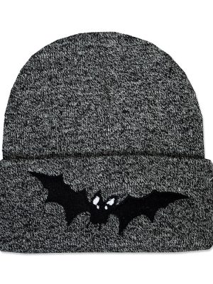 Mottled black and grey knitted beanie hat with wide folded cuff featuring a black embroidered vampire bat with outstretched wings and small white eyes.