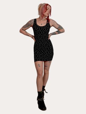 Black punk star mini dress with white all-over star print, fitted silhouette, made in the UK, styled with boots for an alternative look
