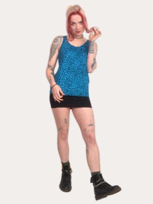 Woman wearing a blue leopard print tank top, punk sleeveless vest, alternative women’s clothing, made in the UK.