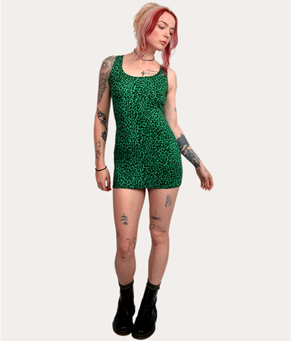 Model wearing a green leopard print mini dress by Poison Clothing, fitted and sleeveless, made in the UK.