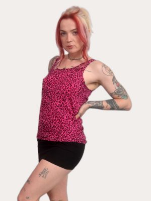 Woman wearing a pink leopard print tank top, sleeveless punk vest, alternative fashion, made in the UK.