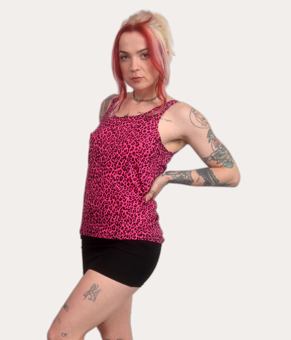 Woman wearing a pink leopard print tank top, sleeveless punk vest, alternative fashion, made in the UK.
