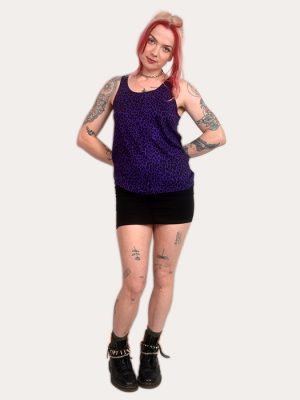 Woman wearing a purple leopard print tank top, punk sleeveless vest, alternative women’s clothing, made in the UK.