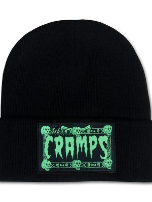 Black cuffed beanie hat featuring a green The Cramps skull logo patch on the front, psychobilly punk winter accessory.
