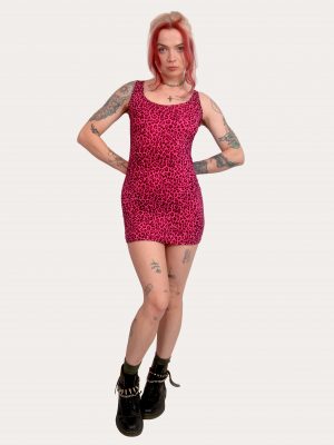 Pink leopard mini dress with fitted silhouette and bold leopard print, styled with boots for a punk alternative look, made in the UK